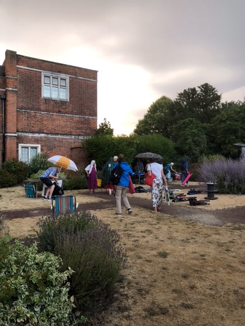 Members being rained on, running for cover