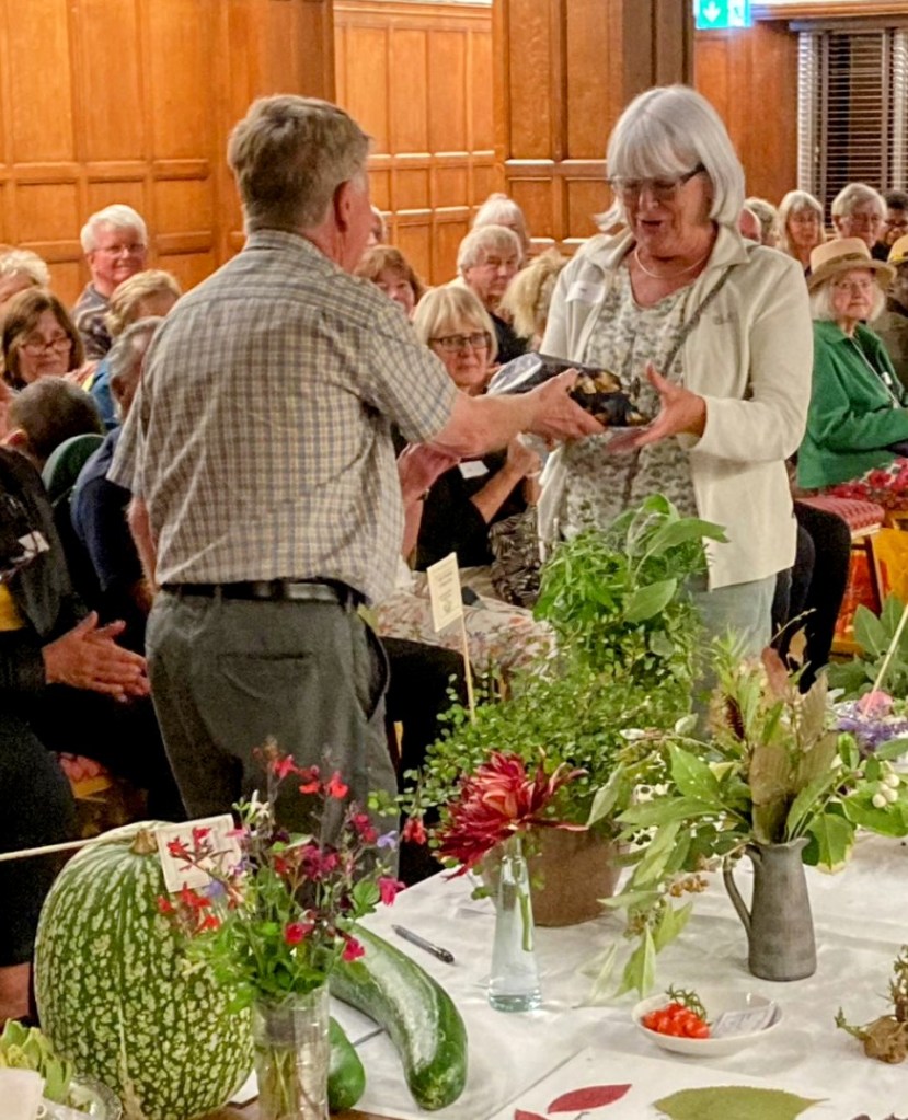 Pat T receiving the 'big bag of crisps' prize as Potato Competition winner, Autumn Show 2023