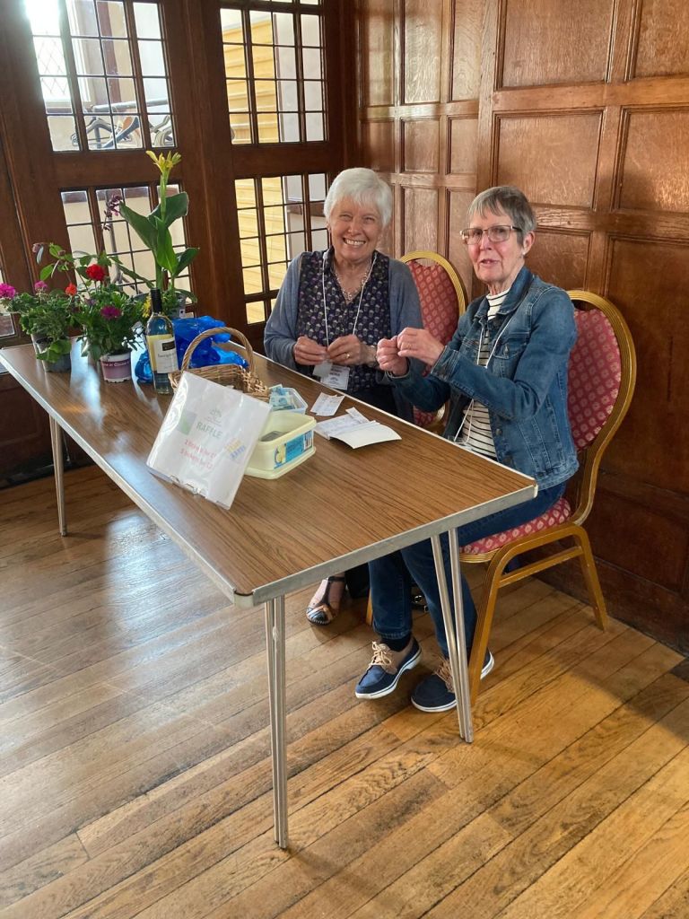 Liz and Ann selling raffle tickets