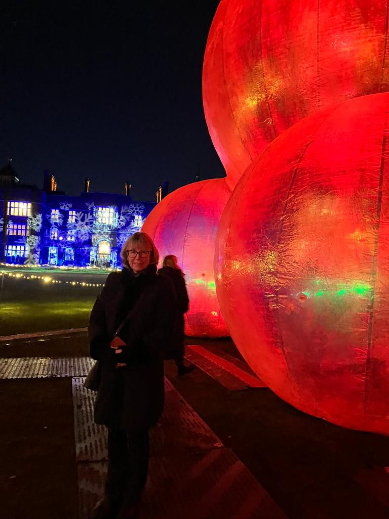 Kathy in front of giant spheres and Charlton House