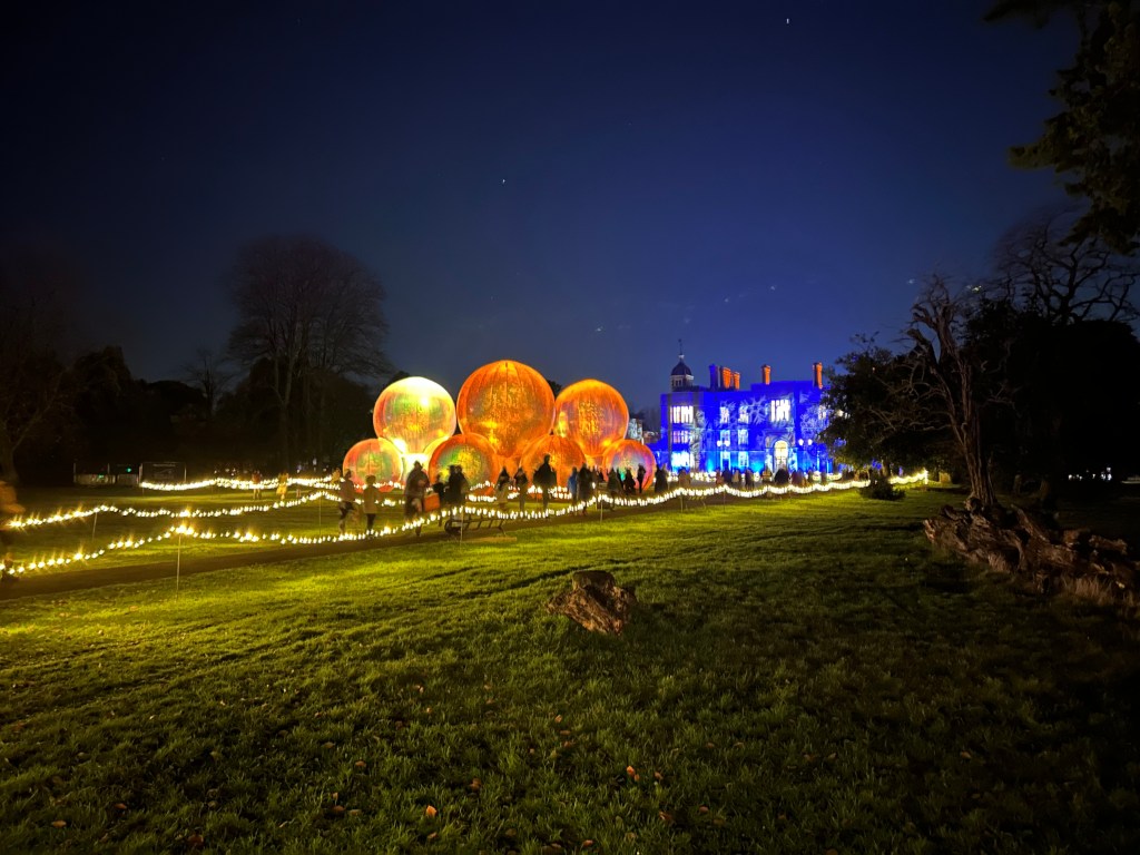 Charlton House lit up, and giant light spheres
