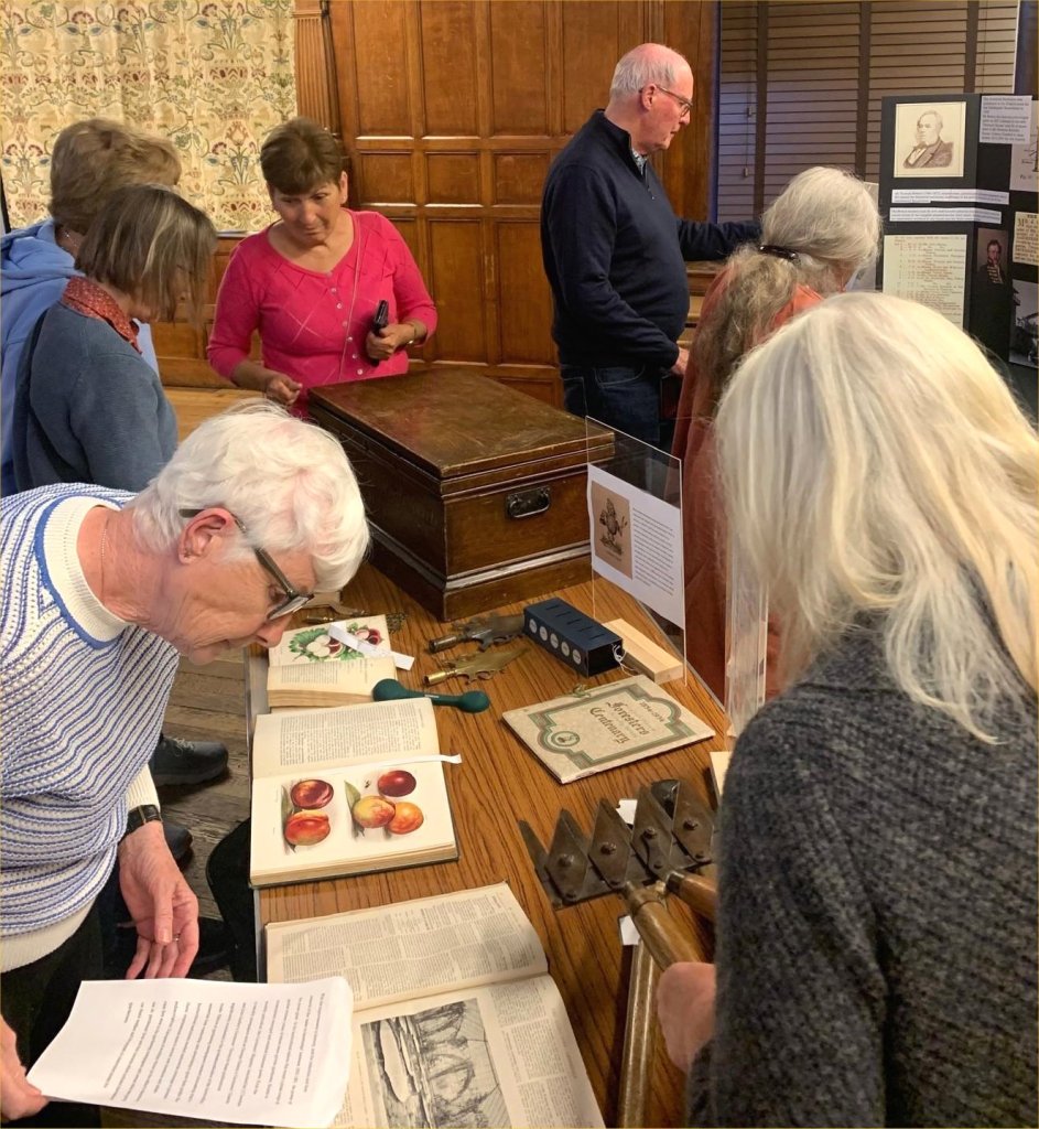 CABAHS members exploring the 19th century gardening artefacts, May 2025