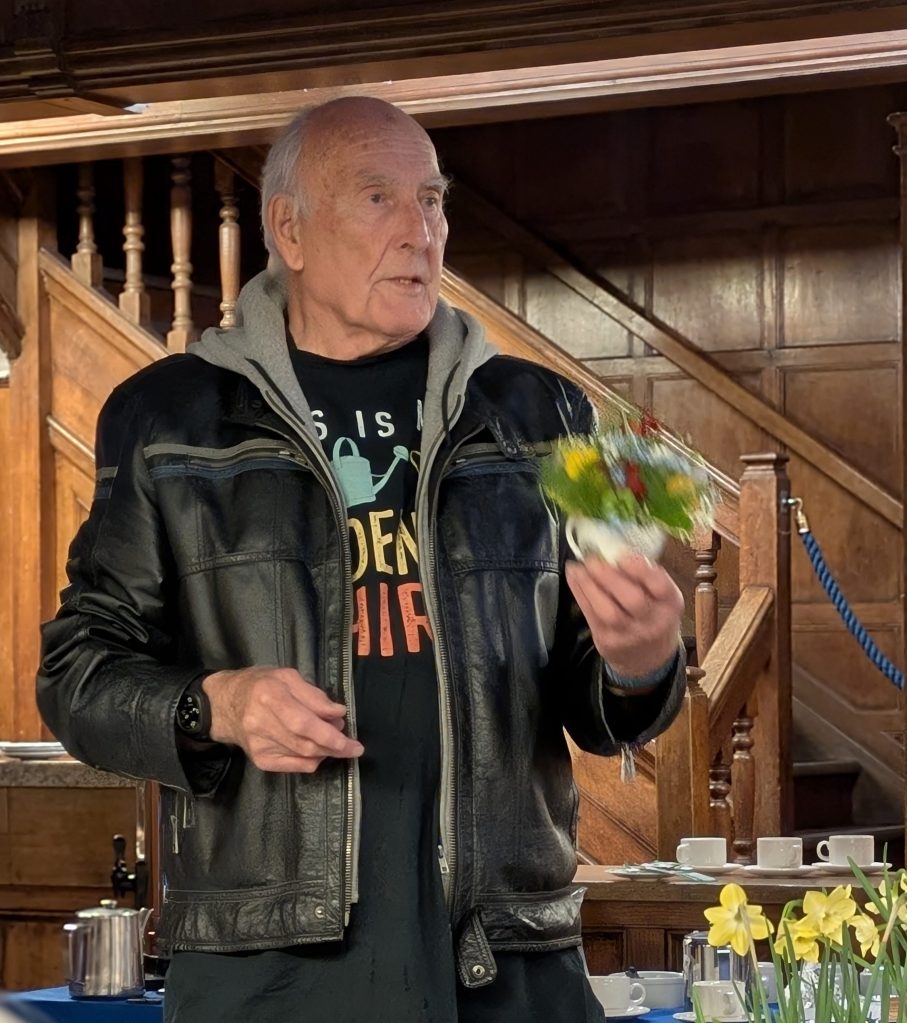 Judge John Hughes waxing lyrical about the teacup displays CABAHS Spring Show 2026