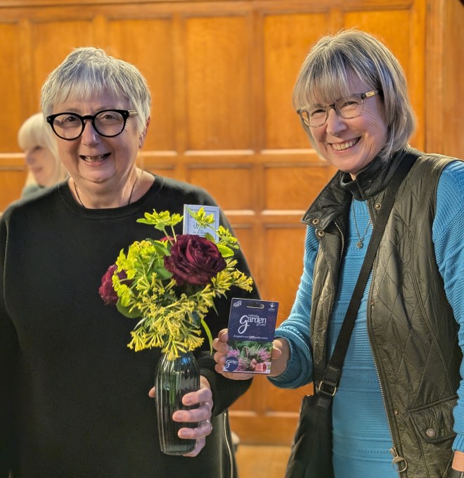 Jayne, winner of May 2026's 'Best on the Table' award, receives her voucher from Kathy