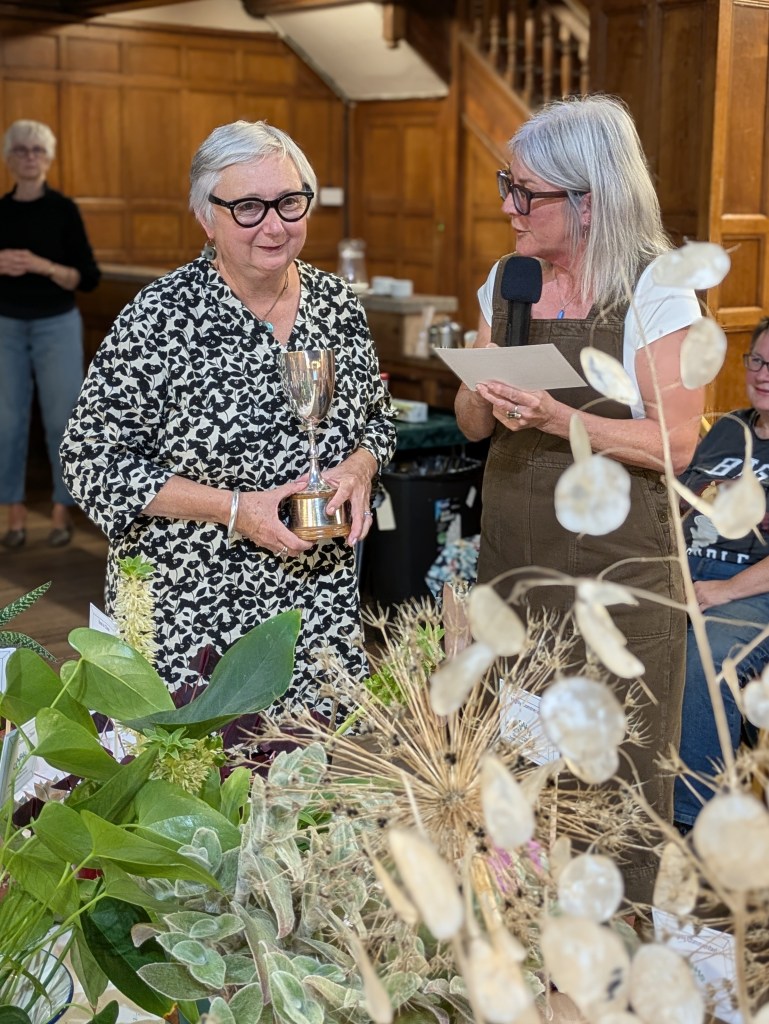 Jayne is awarded the Best in Show cup by judge Susan Urpeth CABAHS Autumn Show 2026