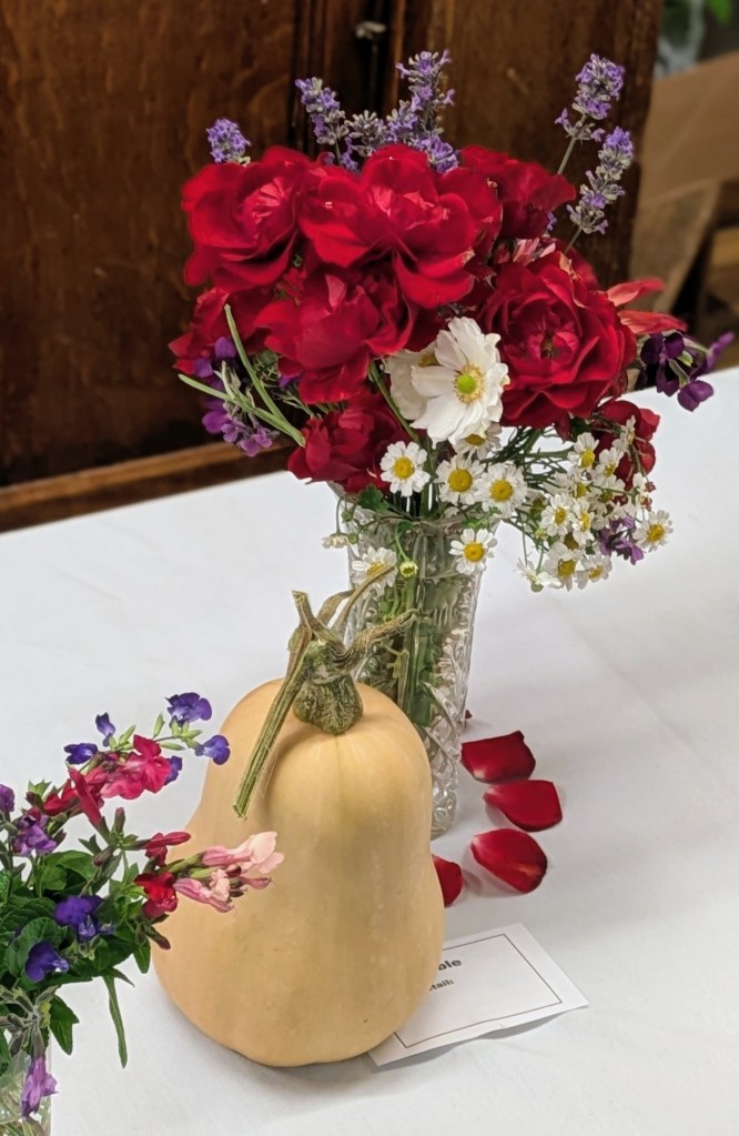An arrangement of roses, lavender, anemones and butternut squash! CABAHS Show Table October 2026